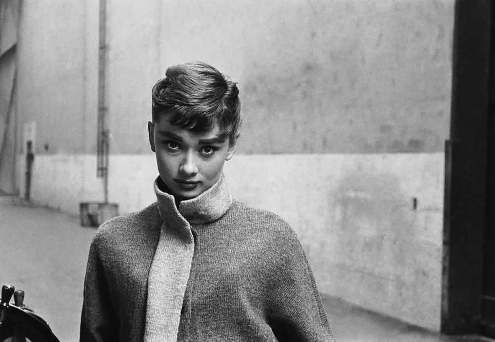 Mark Shaw, ‘Audrey Hepburn in Grey Turtleneck Sweater, Glances Back, 1953’, 1953, Print, Pigment print on Hahnemϋhle photo rag paper, null,