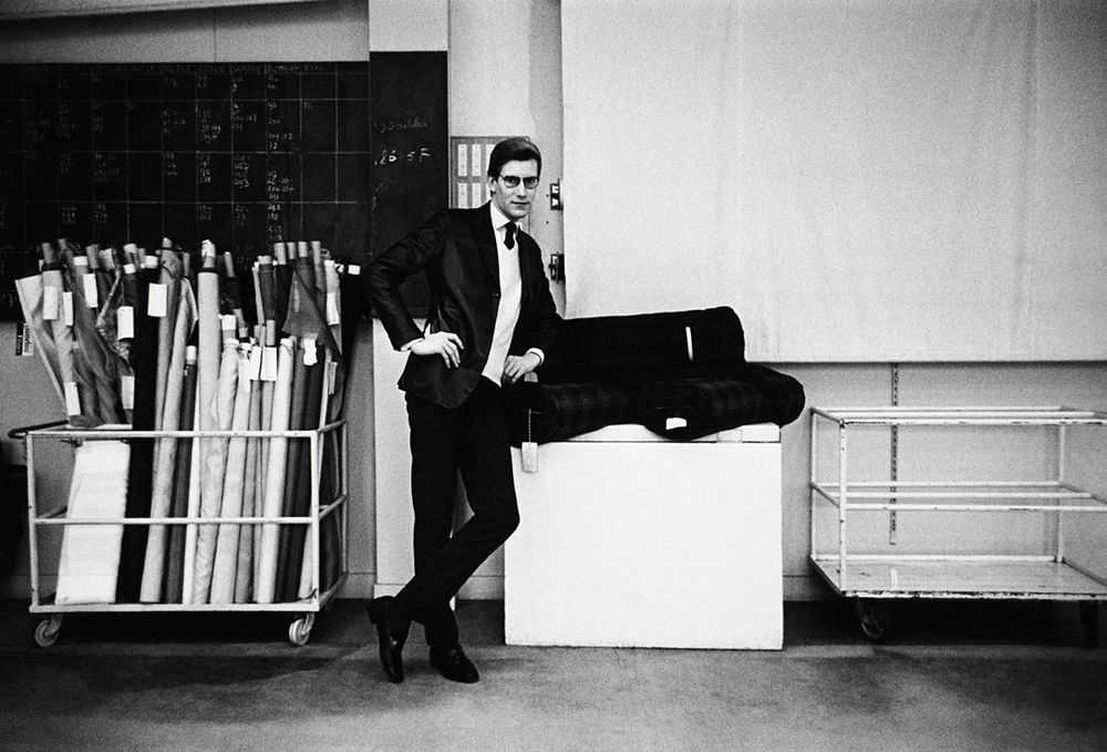 Mark Shaw, ‘Yves St. Laurent With Bolts of Fabric, 1960’, 1960, Print, Pigment print on Hahnemϋhle photo rag paper, null,